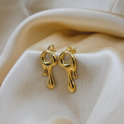 Art-inspired gold studs with a melted liquid metal form, offering a bold yet elegant statement style for everyday and special occasions.