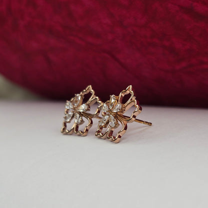 Rose-gold plated flower studs with shimmering crystal petals arranged in a symmetrical bloom design, suitable for both casual and festive styling