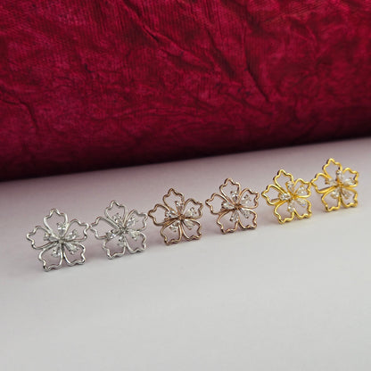 Gold, Rhodium and Rose-gold plated flower studs with shimmering crystal petals arranged in a symmetrical bloom design, suitable for both casual and festive styling