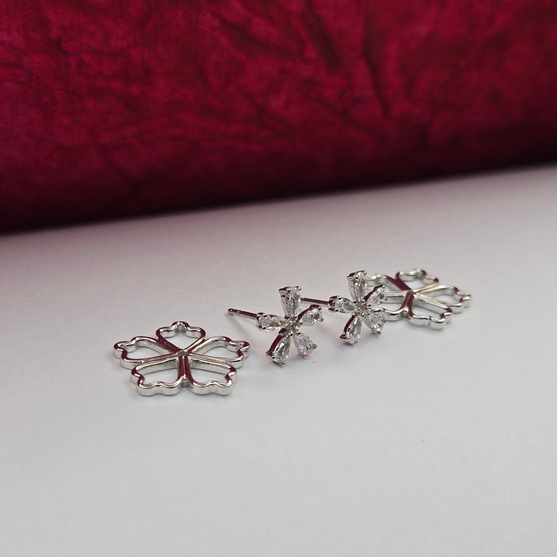 Rose-gold plated flower studs with shimmering crystal petals arranged in a symmetrical bloom design, suitable for both casual and festive styling