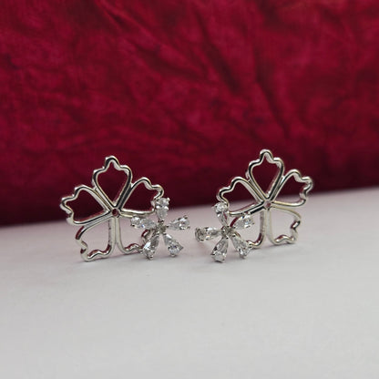 Rhodium-plated flower studs with shimmering crystal petals arranged in a symmetrical bloom design, suitable for both casual and festive styling
