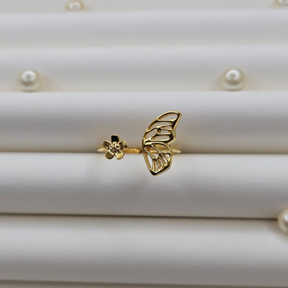 Butterfly wing and flower open band ring in polished gold finish, offering a lightweight and artistic everyday statement look.
