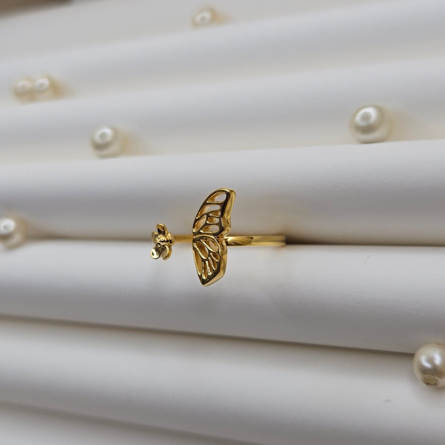 Butterfly wing and flower open band ring in polished gold finish, offering a lightweight and artistic everyday statement look.