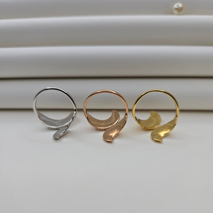 Elegant botanical-inspired ring with twin leaf accents, adjustable fit, and a polished gold, rose-gold, and rhodium stone, perfect for daily wear or stacking.