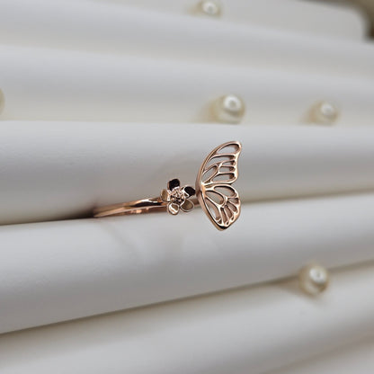 Butterfly wing and flower open band ring in polished rose-gold finish, offering a lightweight and artistic everyday statement look.