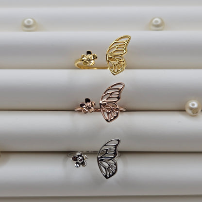 Butterfly wing and flower open band ring in polished gold, rose-gold and rhodium finish, offering a lightweight and artistic everyday statement look.