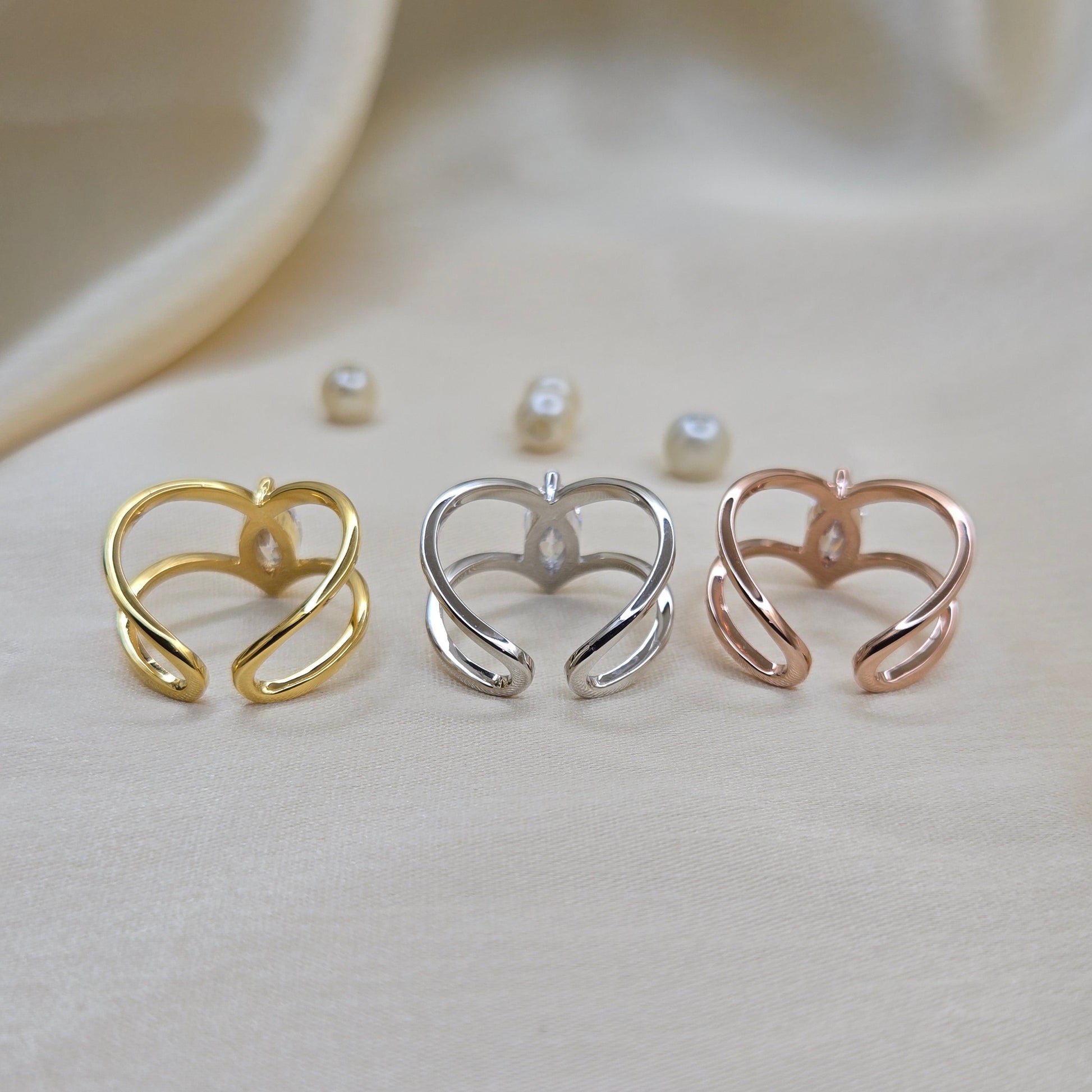 Rhodium, gold and rose-gold plated open band ring with a modern double-band design, featuring a marquise-cut clear zircon stone at the center offering refined sophistication for daily wear or special occasions.