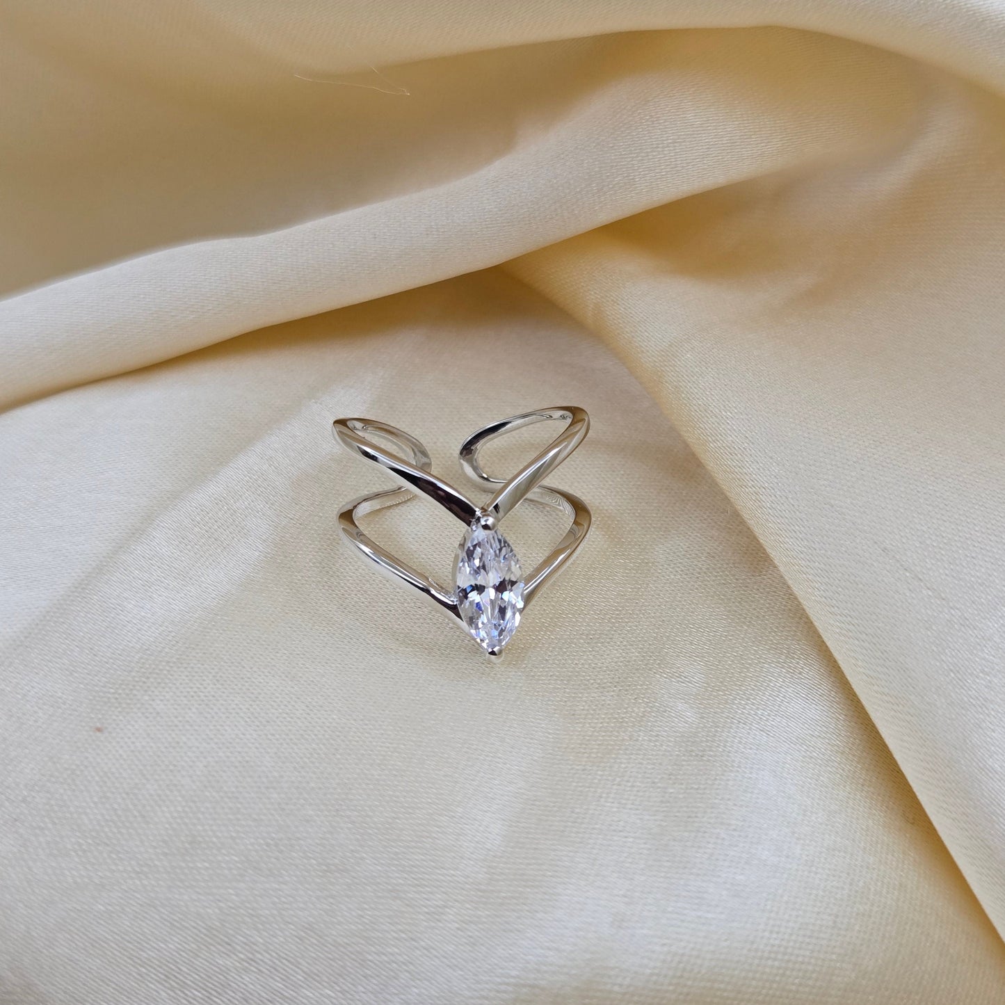 Rhodium-plated open band ring with a modern double-band design, featuring a marquise-cut clear zircon stone at the center offering refined sophistication for daily wear or special occasions.